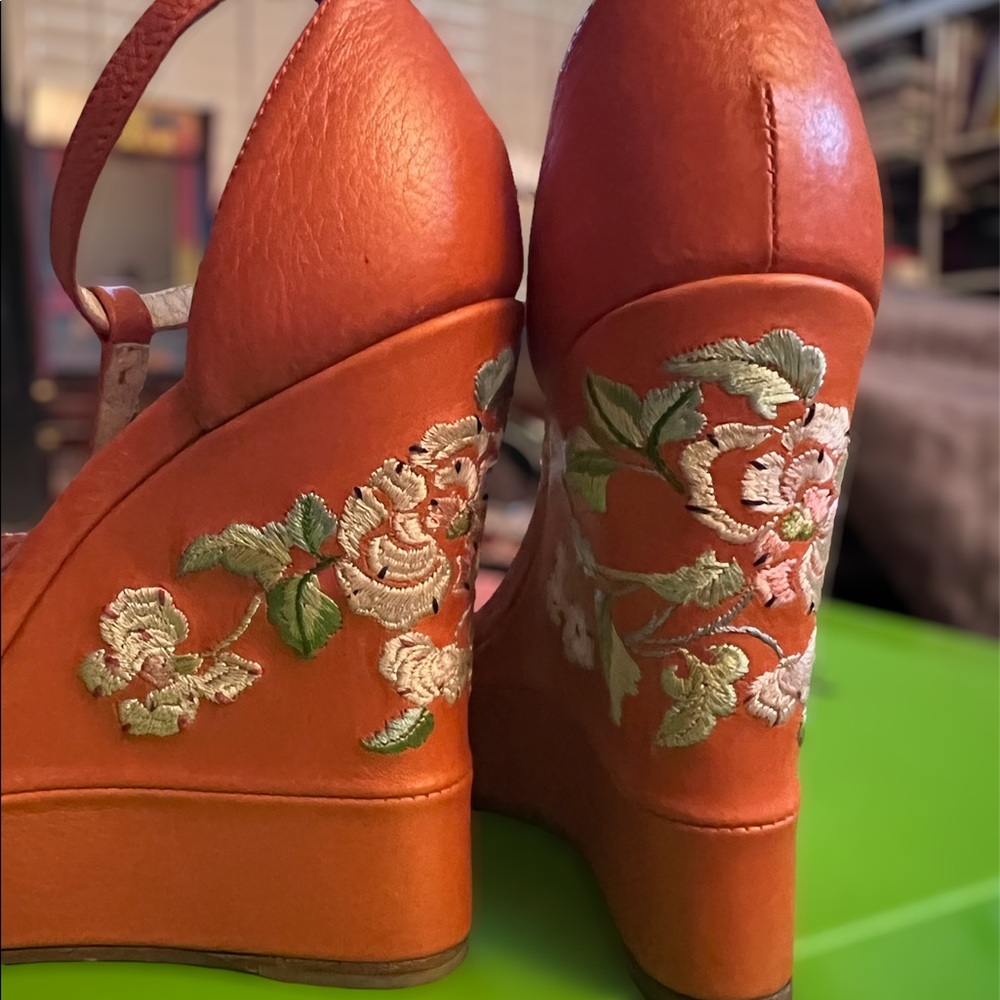 Christian Dior Orange wedges with flower embroidery.
